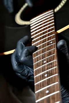 Guitar Luthier Testing Newly Installed String on Rosewood Fretboard Close Up Stock Photos
