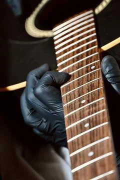 Guitar Luthier Testing Newly Installed String on Rosewood Fretboard Close Up Stock Photos