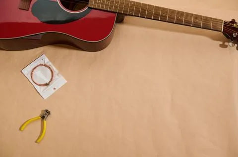 Guitar Maintenance And String Replacement Kit With Pliers And Spare Strings Stock Photos