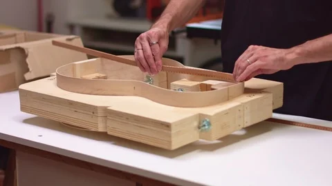 Guitar maker add lining to hand made guitar Видео 117964939