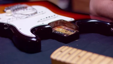 Guitar maker changes the guitar neck Stock Footage 105265599