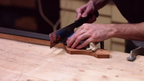 Guitar maker makes cut on guitar neck Stock Footage 122029177