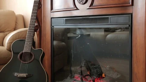 The guitar next to the fireplace Stock Footage 71955819