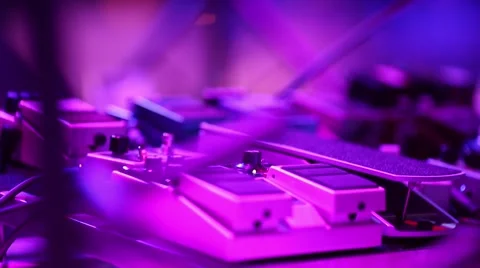 Guitar pedals on stage during performance Stock Footage 50446805