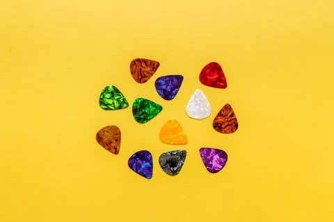 Guitar picks pattern. top view. Music background Stock Photos