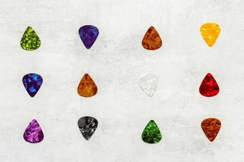 Guitar picks pattern. top view. Music background Stock Photos