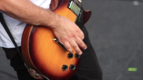 Guitar Played on a Street Stock Footage 65368929