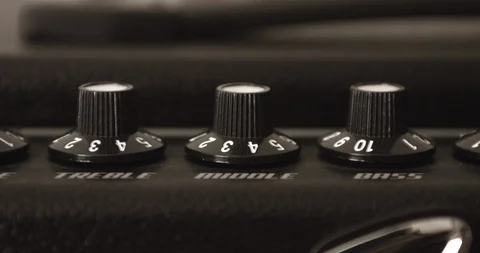 Guitar Player Adjusting Treble Middle And Bass Knobs On Guitar Amp 스톡 동영상 114633076