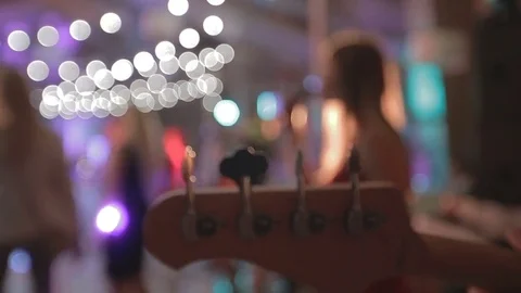 Guitar player and singer with no face perform rhythmic music at party Video stock 72379276