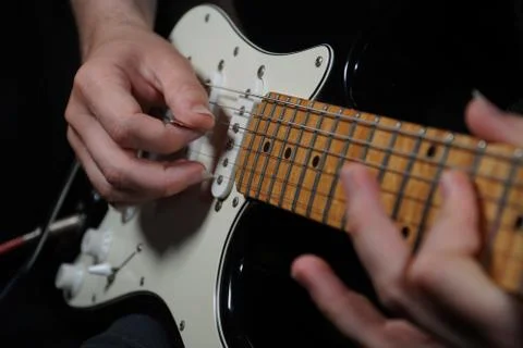 Guitar player on black background 스톡 사진