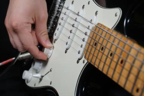 Guitar player on black background 스톡 사진