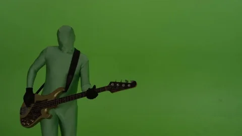 Guitar player on chroma key background, dressed in a greenscreen suit. Stock Footage 70203787