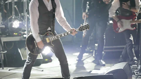 Guitar player on concert stage Stock Footage