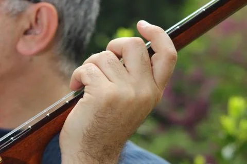 Guitar player by ear Stock Photos