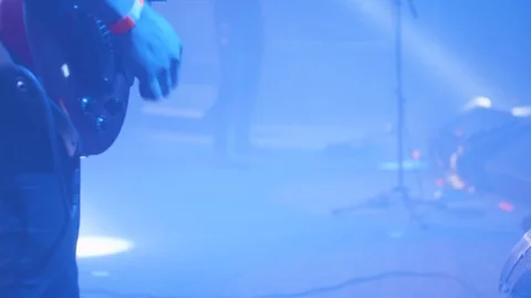 Guitar player in front of a crowd at a rock concert Stock Footage 106327022