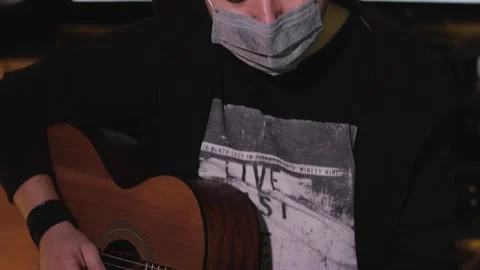 Guitar player in home recording studio in pandemic 库存影片 148300940