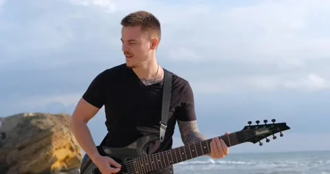 Guitar player outdoors Stock Footage 145139101