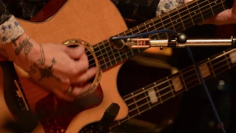 Guitar player performing in studio Stock Footage 136342152