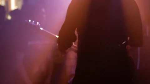 Guitar player silhouette with crowd in the background at a live concert 動画素材 82284836