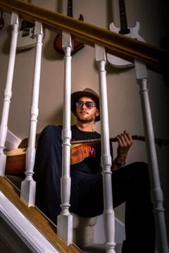 Guitar player on the steps Stock Photos