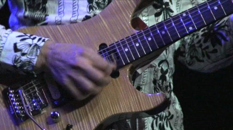 Guitar Player Stroking Instrument During Performance Stock Footage 156094