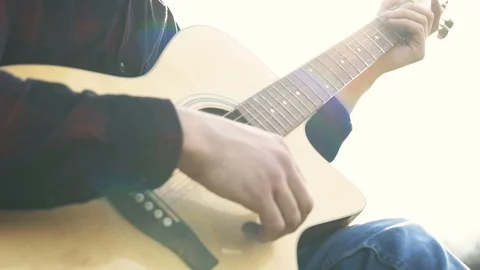 Guitar playing. Alone man playing on a guitar outdoors. Game on strings. Stock Footage 109179844