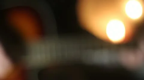 Guitar playing  with candles Stock Footage 10897502