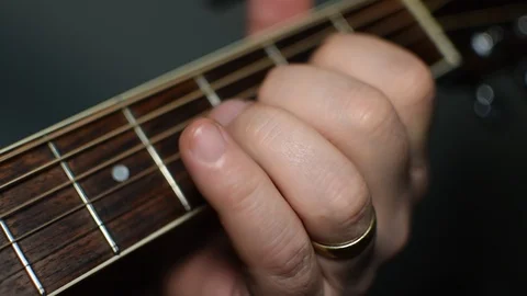 Guitar playing close up with shallow depth of field Stock Footage 87746940