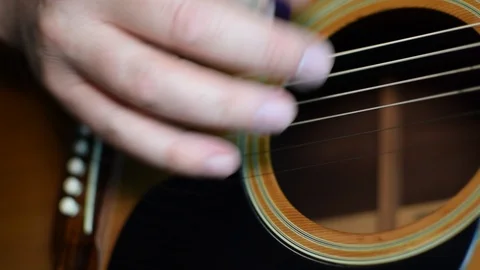 Guitar playing close up with shallow depth of field Stock Footage 87747010
