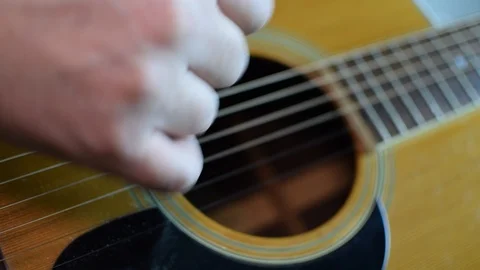 Guitar playing close up with shallow depth of field Stock Footage 87747038
