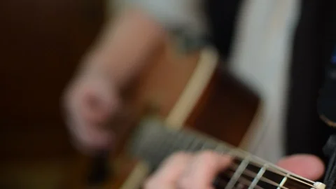 Guitar playing close up with shallow depth of field Stock Footage 87747376