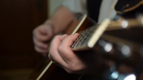 Guitar playing close up with shallow depth of field Stock Footage 87747422