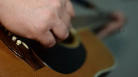 Guitar playing close up with shallow depth of field Stock Footage 87747506