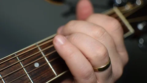 Guitar playing close up with shallow depth of field Stock Footage 87747666