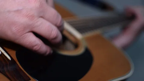 Guitar playing close up with shallow depth of field Stock Footage 87747922