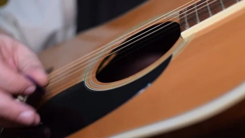 Guitar playing close up with shallow depth of field Stock Footage 87747965