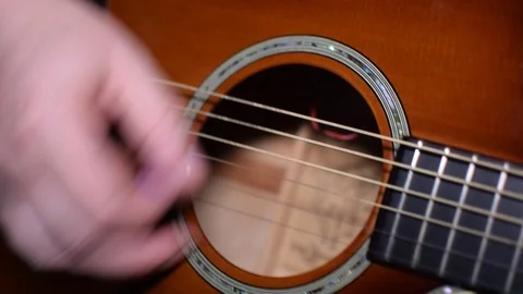 Guitar playing close up with shallow depth of field Stock Footage 87748744