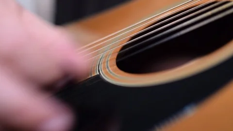 Guitar playing close up with shallow depth of field Stock Footage 87748958