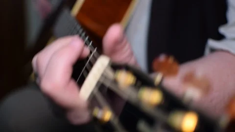 Guitar playing close up with shallow depth of field Stock Footage 87748999