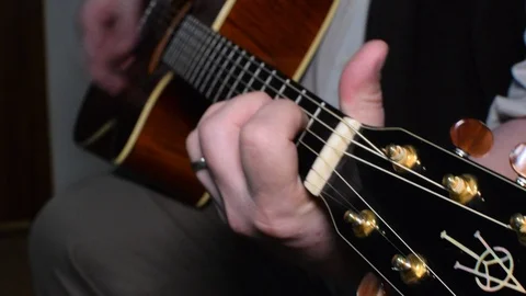 Guitar playing close up with shallow depth of field Stock Footage 87749208