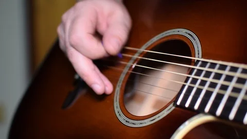 Guitar playing close up with shallow depth of field Stock Footage 87749913