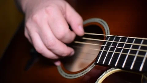 Guitar playing close up with shallow depth of field Stock Footage 87750093