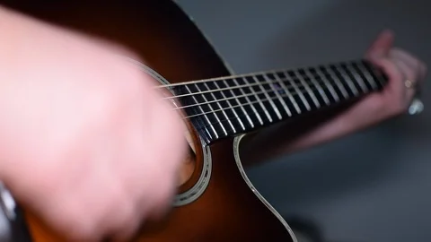 Guitar playing close up with shallow depth of field Stock Footage 87750139