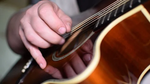 Guitar playing close up with shallow depth of field Stock Footage 87750609