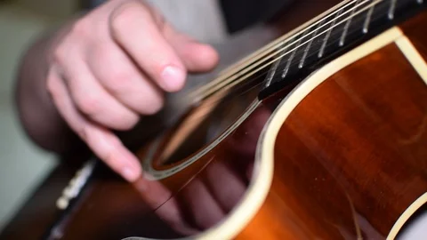Guitar playing close up with shallow depth of field Stock Footage 87750728
