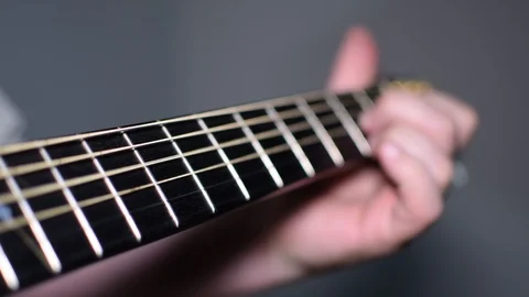 Guitar playing close up with shallow depth of field Stock Footage 87751192