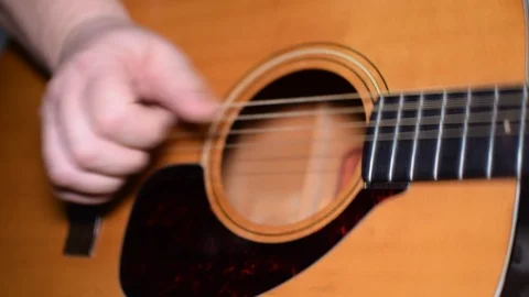 Guitar playing close up with shallow depth of field Stock Footage 87751337