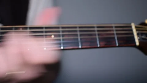 Guitar playing close up with shallow depth of field Stock Footage 87751519