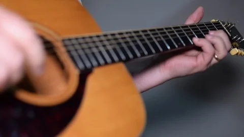 Guitar playing close up with shallow depth of field Stock Footage 87751726