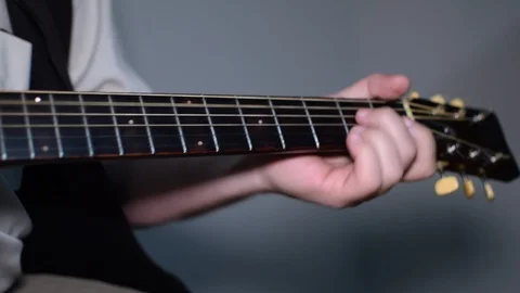 Guitar playing close up with shallow depth of field Stock Footage 87751793